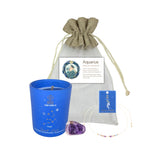 Blue candle with Aquarius design, amethyst crystal, and drawstring bag on a white background