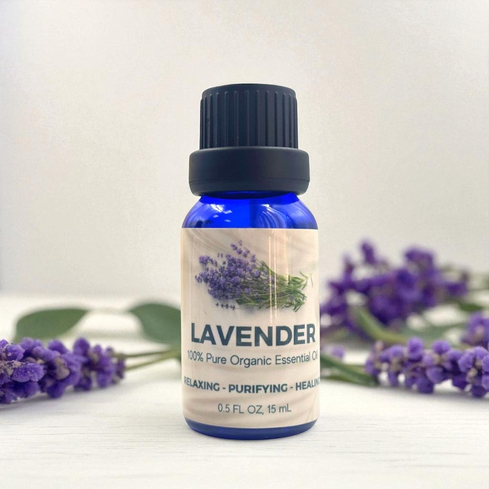 Bottle of lavender essential oil with lavender flowers on a white background