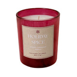 A red glass jar candle with a beige paper label reading 'HOLIDAY SPICE' and 'GINGER - CINNAMON - VANILLA' on a white background.