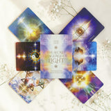Set of tarot cards titled 'The Secret Language of Light' on a white background with flowers.