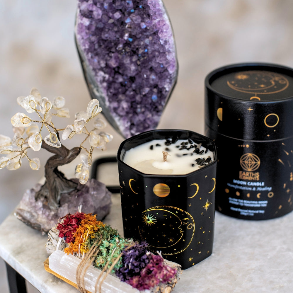 crystal tree, selenite chakra sage bundle, moon candle, and amethyst geode