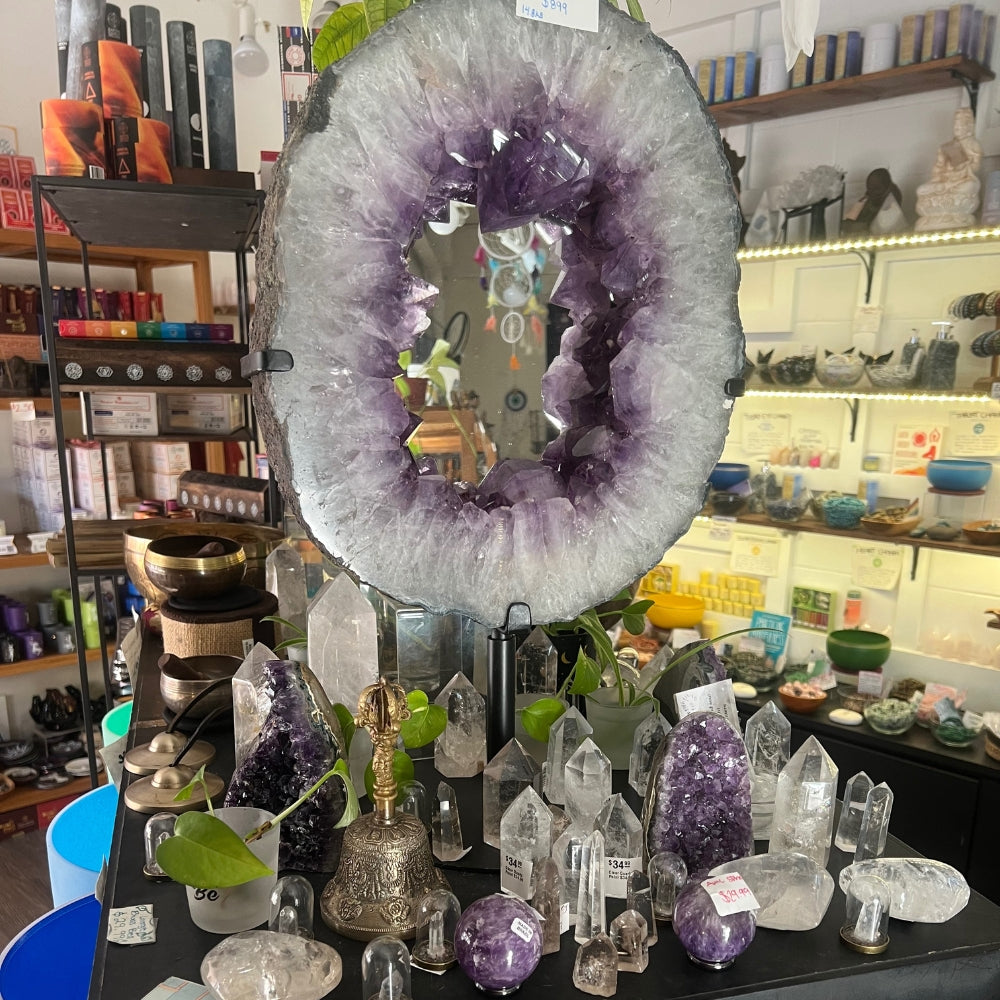 Large geode on stand on crystal display table in Little Italy store